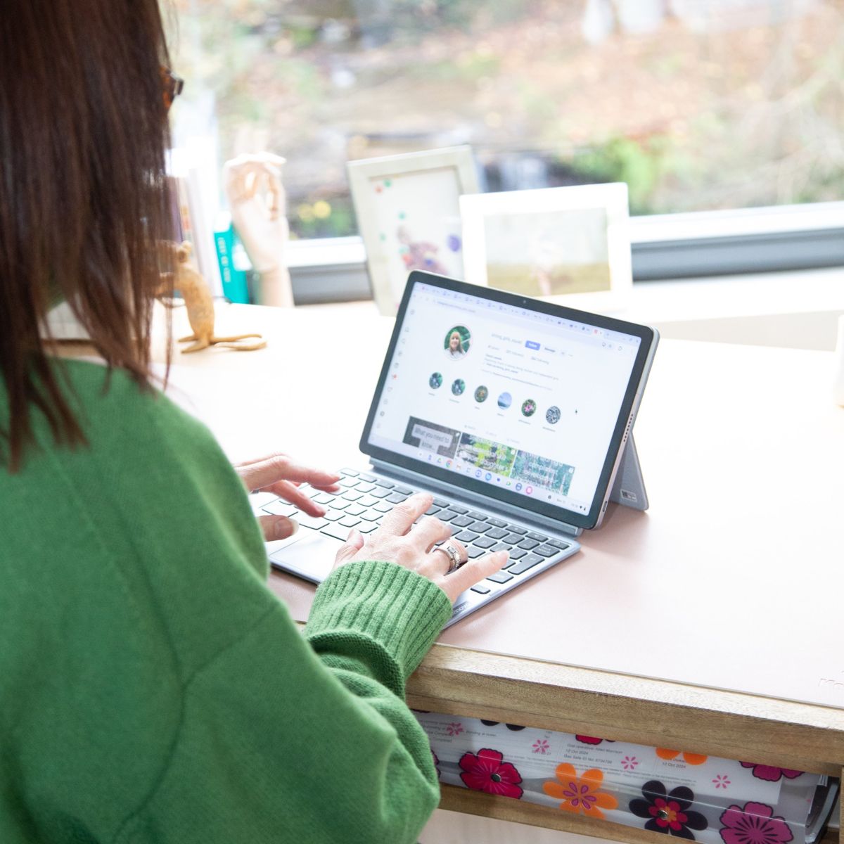 Business owner working on her social media at her desk