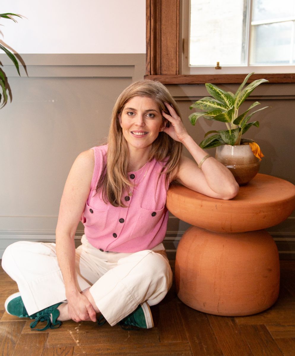 Business owner sitting by a terracotta table at The Hoxton